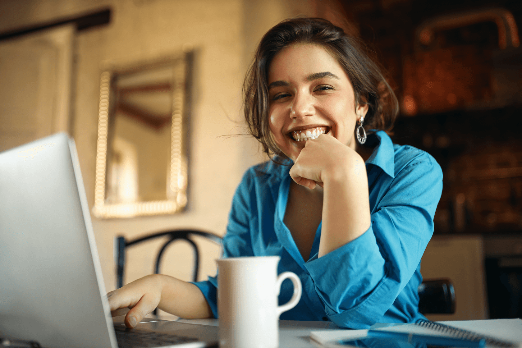 happy looking woman smilling in her home office