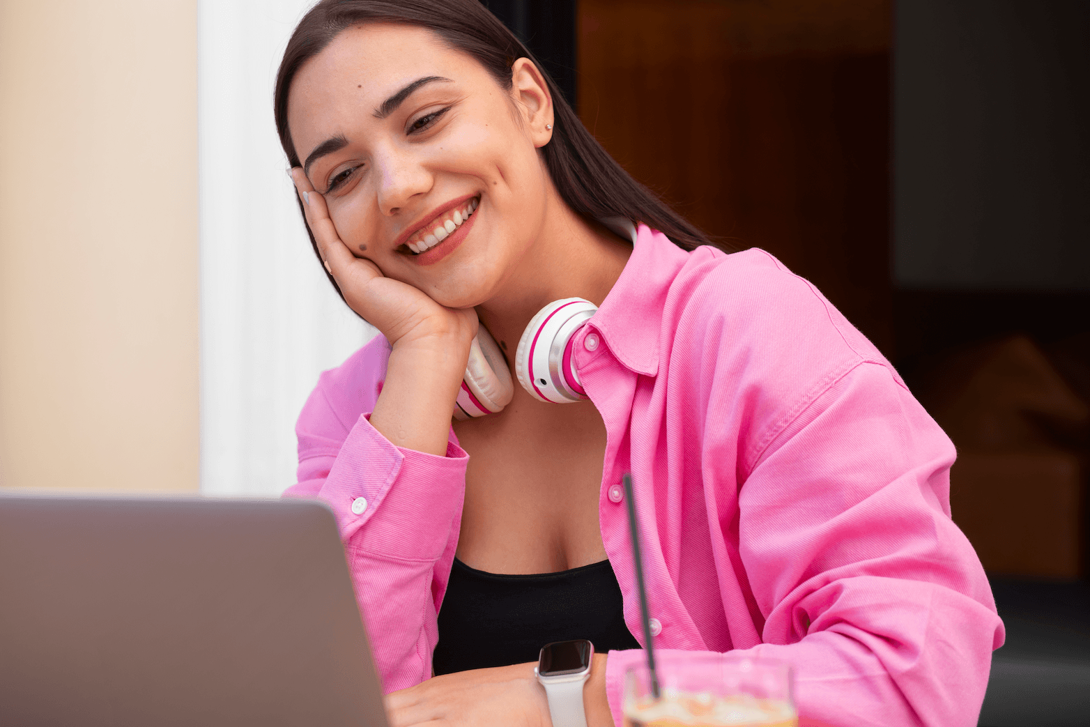 woman smilling working with a laptop