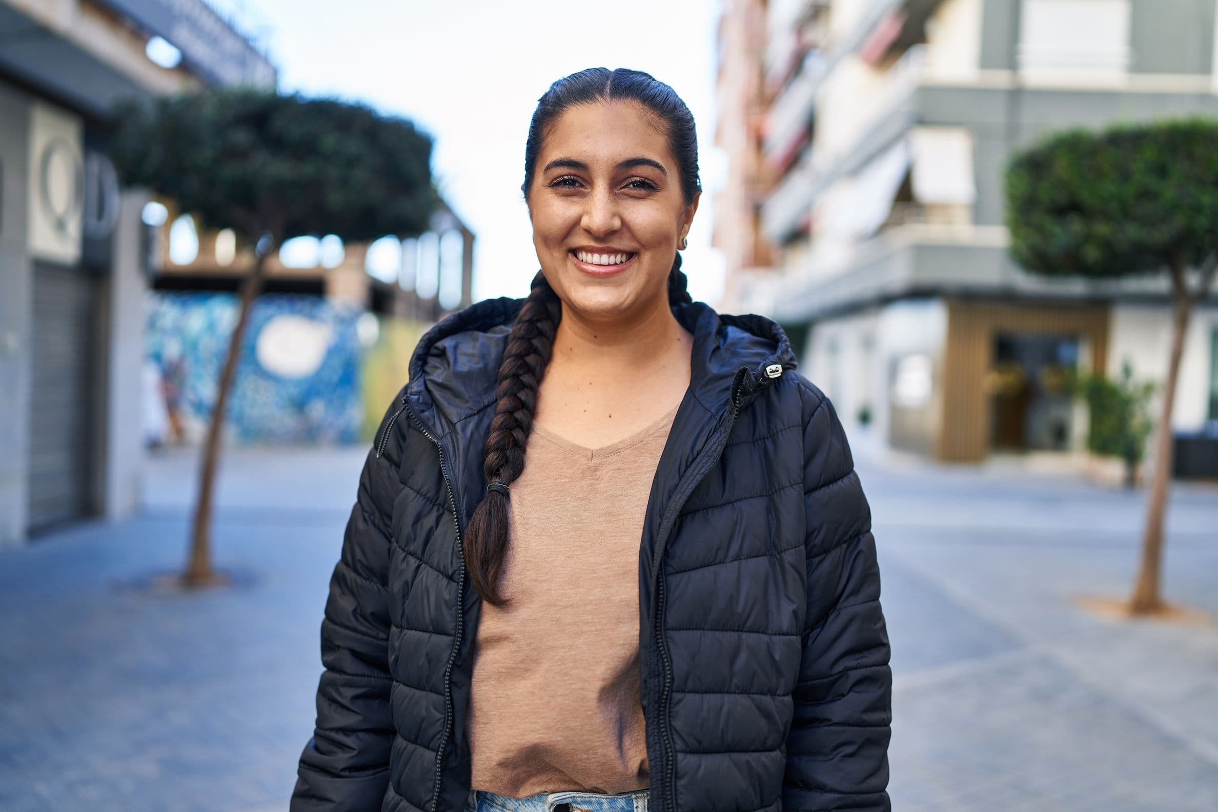 happy woman with a ponytail posing